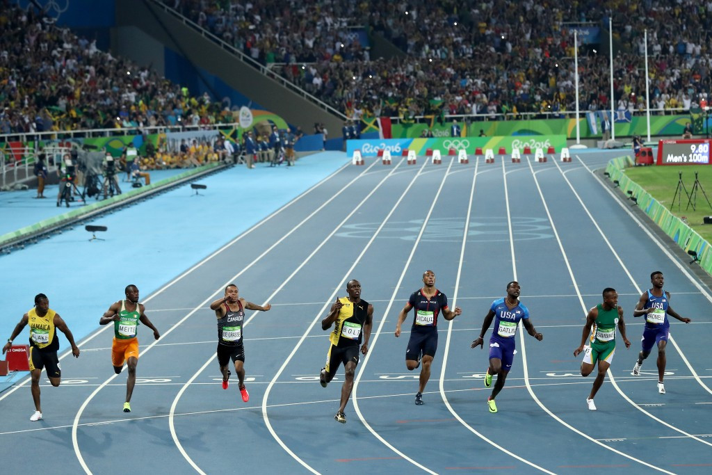 Usain Bolt wins his third consecutive Olympic 100m title in 9.80sec ahead of Justin Gatlin, third right, who clocked 9.89 and Andre de Grasse of Canada, third left, who took bronze in 9.91 ©Getty Images