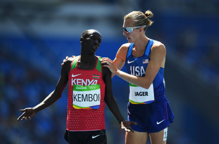 US silver medallist Evan Jager speaks to Kenya's 2004 and 2012 Olympic champion Ezekiel Kemboi after they have taken silver and bronze respectively in the 3,000m steeplechase  ©Getty Images