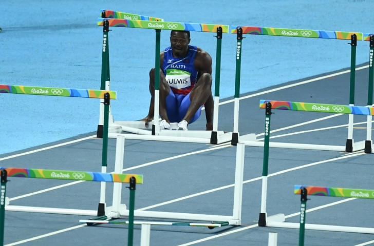 Decision time for Jeffrey Julmis of Haiti in the semi-final of the men's 110m hurdles. He decided to get up and complete the Olympic course...©Getty Images