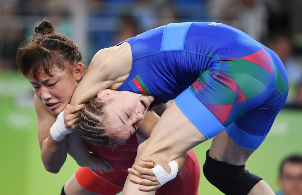 Eri Tosaka, left, came from behind in the final seconds to win the under 49kg gold medal contest ©Getty Images