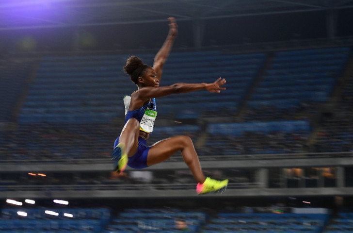 Tianna Bartoletta flies out to a personal best of 7.17m in the last round to deprive her US compatriot and defending champion Brittney Reese of successive Olympic victories ©Getty Images