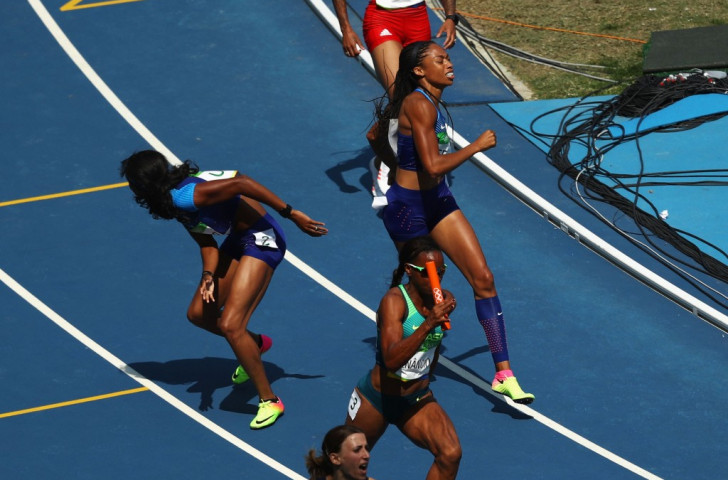 Allyson Felix (right) and English Gardner react as their second changeover in the women's 4x100m heats comes to grief - but the US quartet got a re-run on appeal ©Getty Images