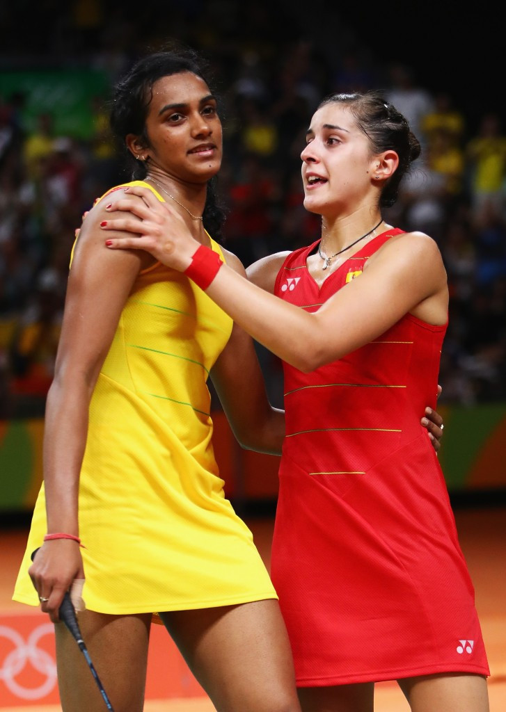 Spain's Carolina Marin, in red, consoles India's Pusarla Venkata Sindhu after she had beaten her at Rio 2016 to become the first non-Asian winner of the Olympic women's singles title ©Getty Images