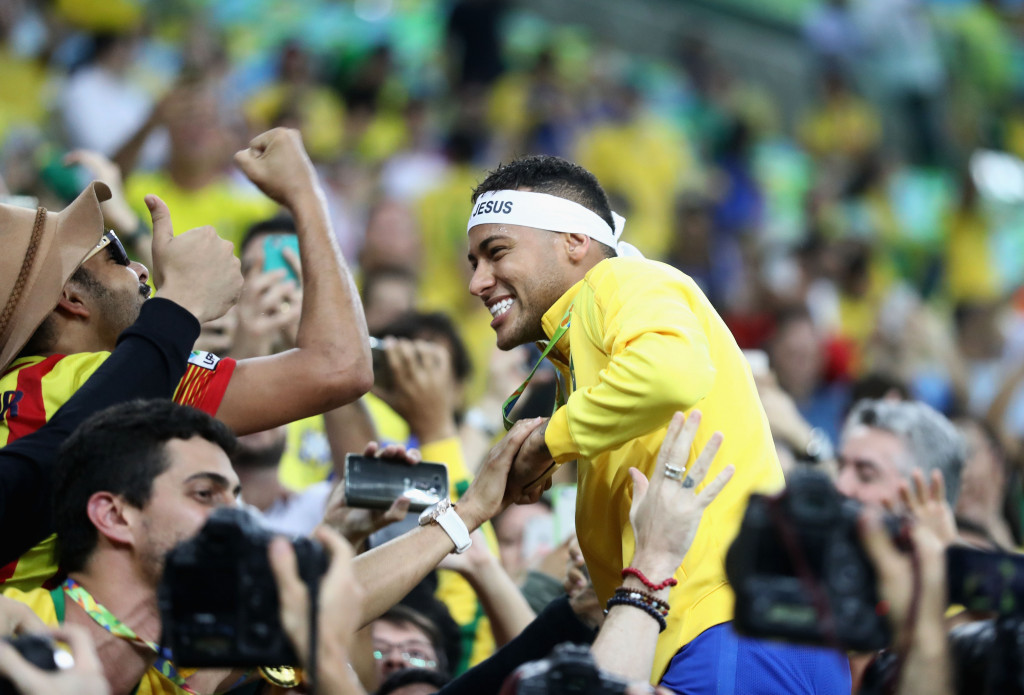 Supporters surround Neymar following the historic first men's football Olympic gold medal for Brazil ©Getty Images