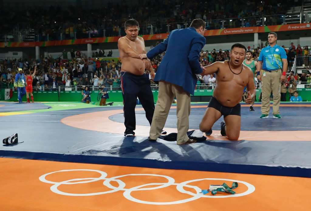 Mongolian coaches protested a bronze medal loss by removing their clothes ©Getty Images