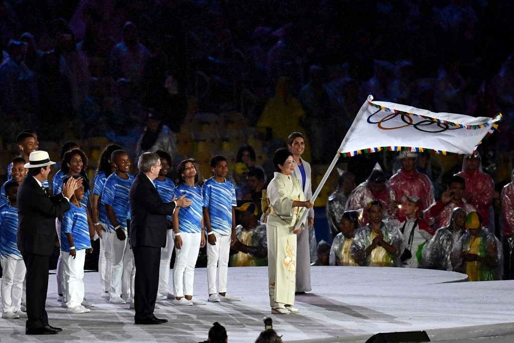 The review was called for by Yuriko Koike, pictured receiving the Olympic flag at the Closing Ceremony of Rio 2016 ©Getty Images