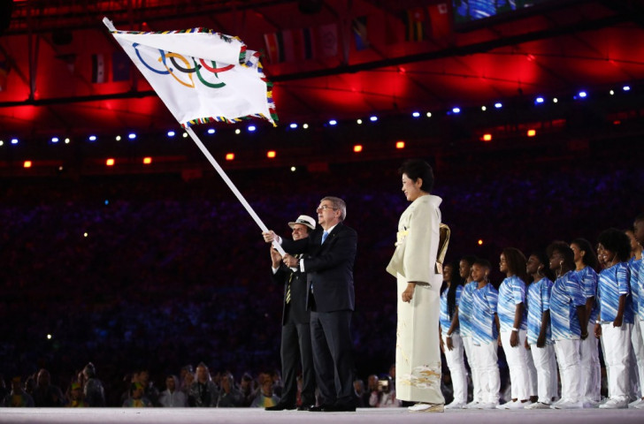 IOC President Thomas Bach enjoyed waving the Olympic flag before declaring the Games of the XXXI 