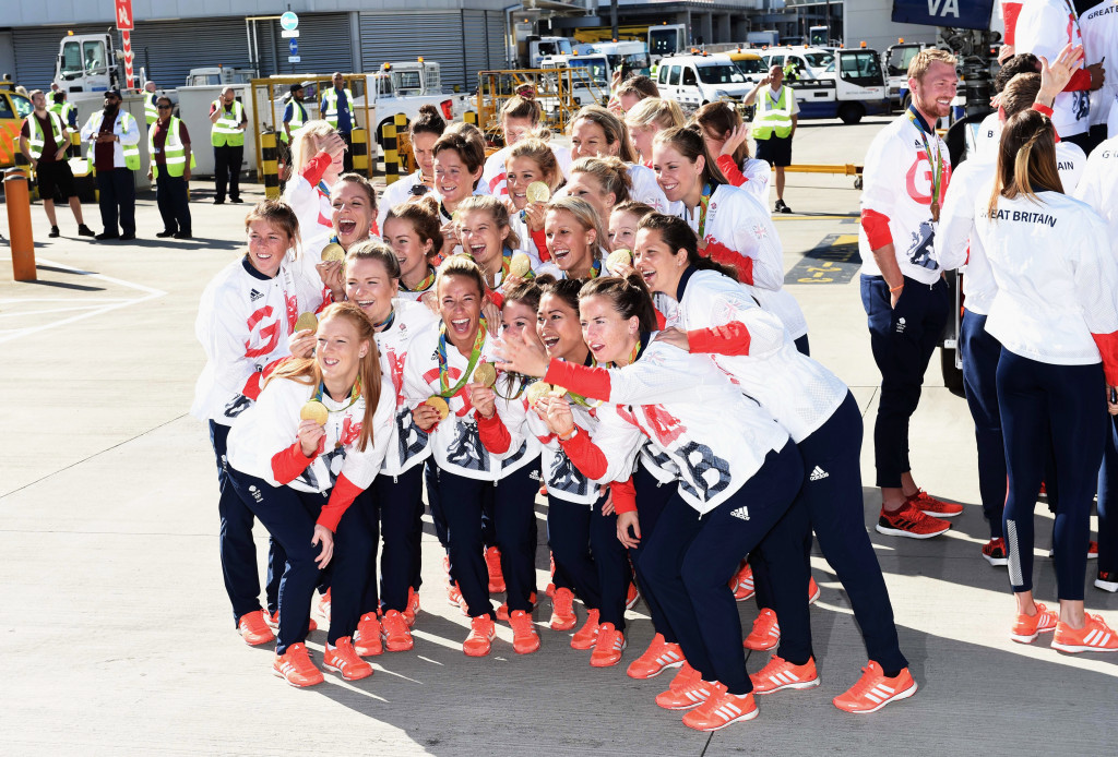 Britain's victorious women's hockey team pose following their return to London ©Getty Images