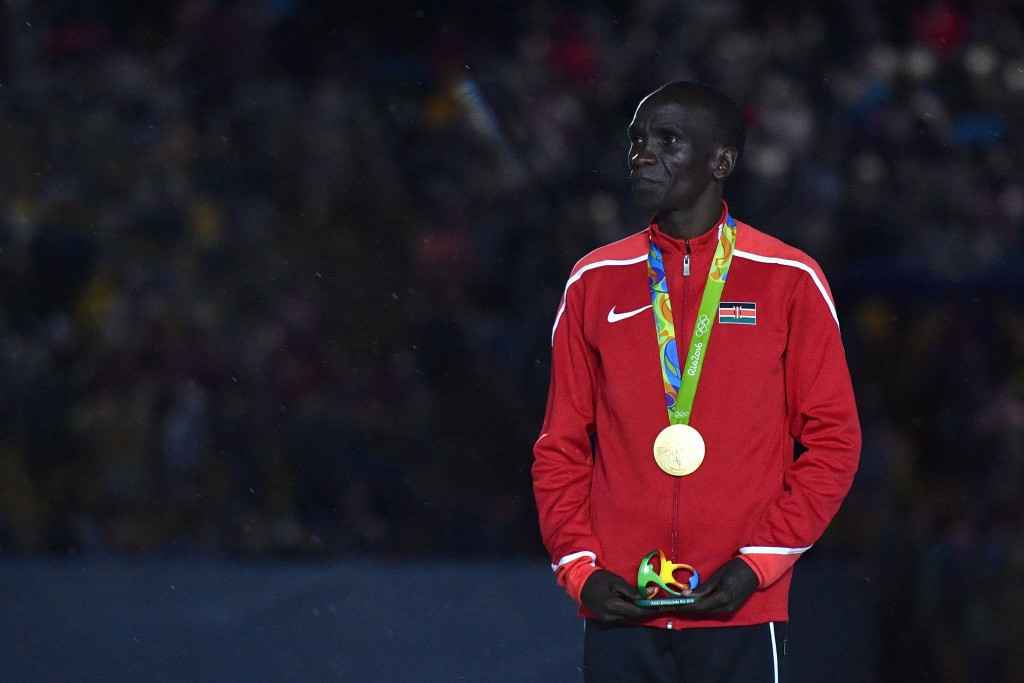 Eliud Kipchoge received his marathon gold medal in the Closing Ceremony of Rio 2016, but problems have mounted away from the sport ©Getty Images