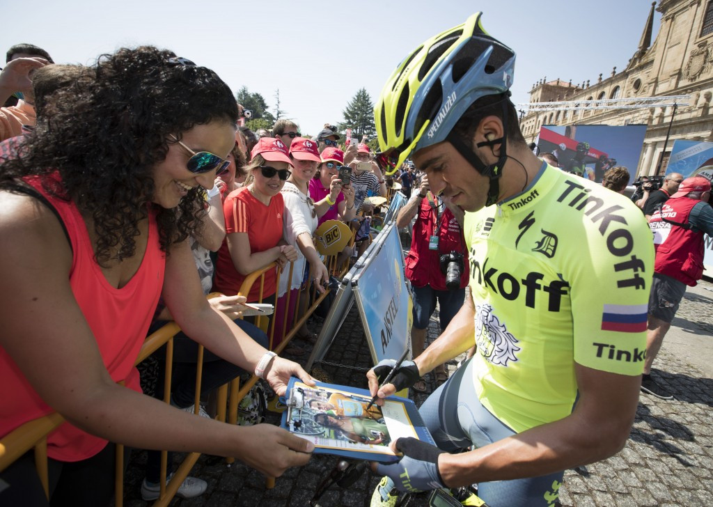 Two-time Tour de France winner Alberto Contador signs autographs prior to the start of the stage ©Getty Images