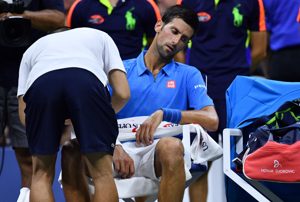 Novak Djokovic needed treatment on an arm injury before he battled through to reach round two ©Getty Images