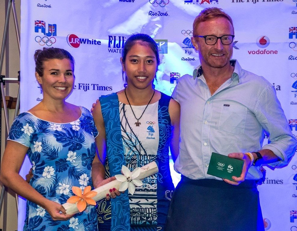 Team Fiji’s Sally Yee (centre) presented a farewell gift to Team Fiji Men's 7s Coach, Ben Ryan in appreciation of the success of the National men’s rugby 7s team ©FASANOC