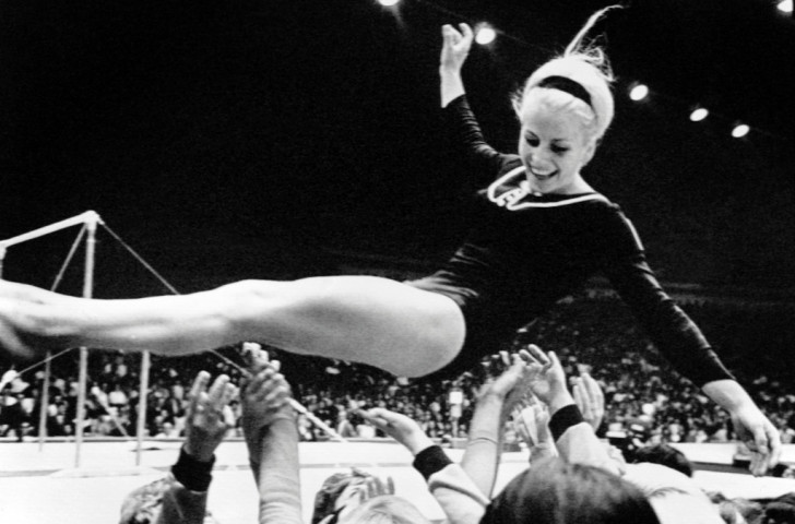 Vera Caslavska of Czechoslovakia is thrown into the air by supporters at the 1968 Mexico Games, where she won four gymnastics golds and two silvers - but her landing was harsh when she returned home, having made a podium protest against the ruling Soviet forces ©Getty Images
