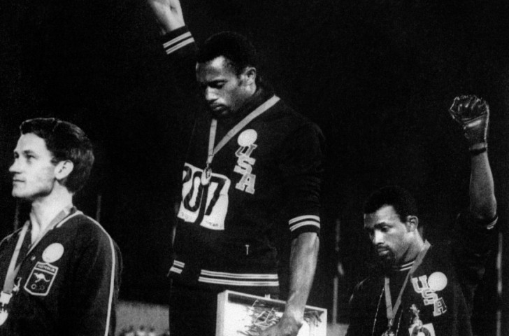 An iconic image of sport meeting politics as US sprinters Tommie Smith (centre) and John Carlos offer Black Power salutes in solidarity with fellow African Americans at the 1968 Mexico Olympics 200m medal ceremony, with Australia's silver medallist Peter Norman (left) tacitly supporting them by wearing the same badge, representing the Olympic Project for Human Rights ©Getty Images 