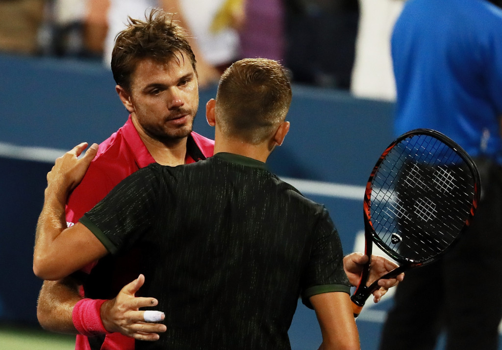 Stanislas Wawrinka of Switzerland had to save a match point before earning a five set win over Britain's Dan Evans ©Getty Images