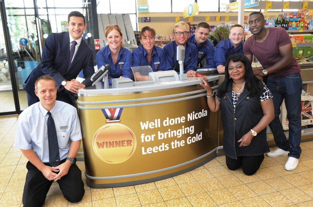 Aldi in Burley in Leeds, revealed its gold till in honour of Yorkshire doube Olympic boxing champion Nicola Adams, an event attended by her mother Dee, right ©Aldi