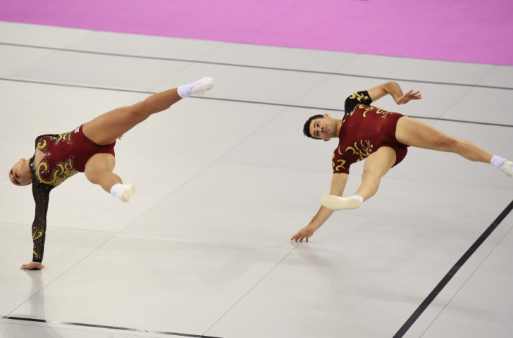 Italian gymnasts Davide Donati (right) and Michela Castoldi (left) compete in the aerobic mixed pairs qualification ©Getty Images