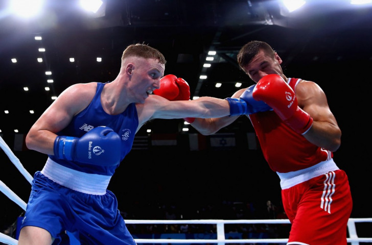 Ireland's Michael O'Reilly (blue) and Croatia's Sajin Pol Vrgoc (red) compete in the men's middleweight round of 32 ©Getty Images 