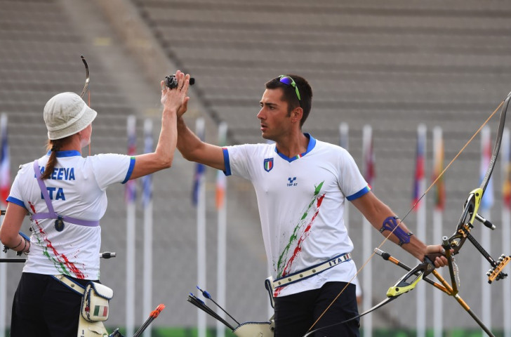 Italy's Natalia Valeeva (left) and Mauro Nespoli (right) celebrate during the mixed team archery competition, which they won ©Getty Images