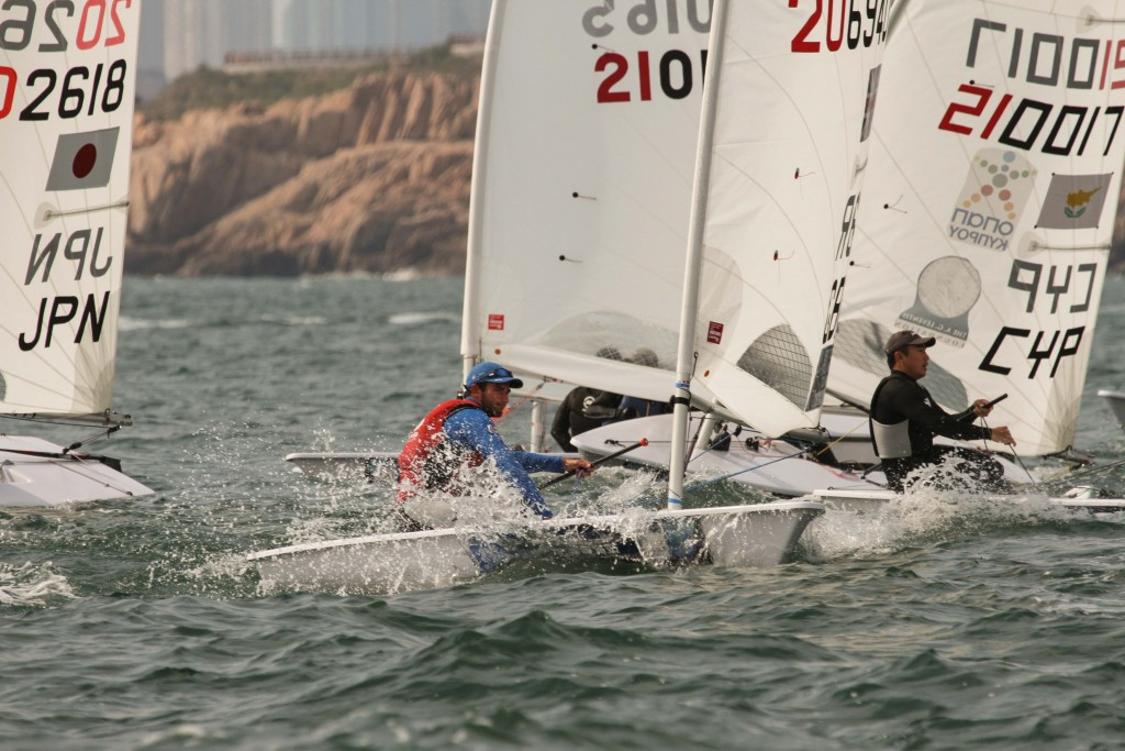 Great Britain's Lorenzo Brando Chiavarini, who scored a second and fourth placed finish, moved in to second in the men's laser event but still trials Croatia's Tonči Stipanović by 11 points ©World Sailing