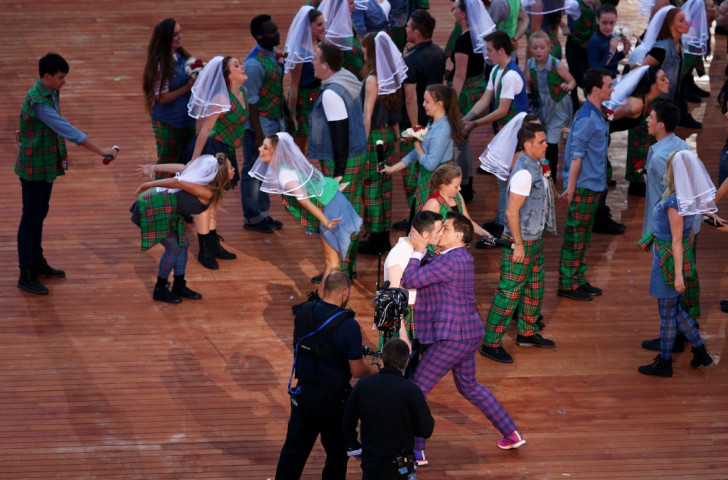 Actor and musician John Barrowman has a very public kiss with another man during the Opening Ceremony of the 2014 Commonwealth Games in Glasgow - an event broadcast to a billion TV viewers ©Getty Images