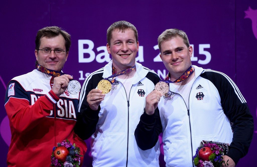 Christian Reitz (centre) celebrates his gold medal along with silver medallist Alexei Klimov (left) and Oliver Geis (right) ©Getty Images