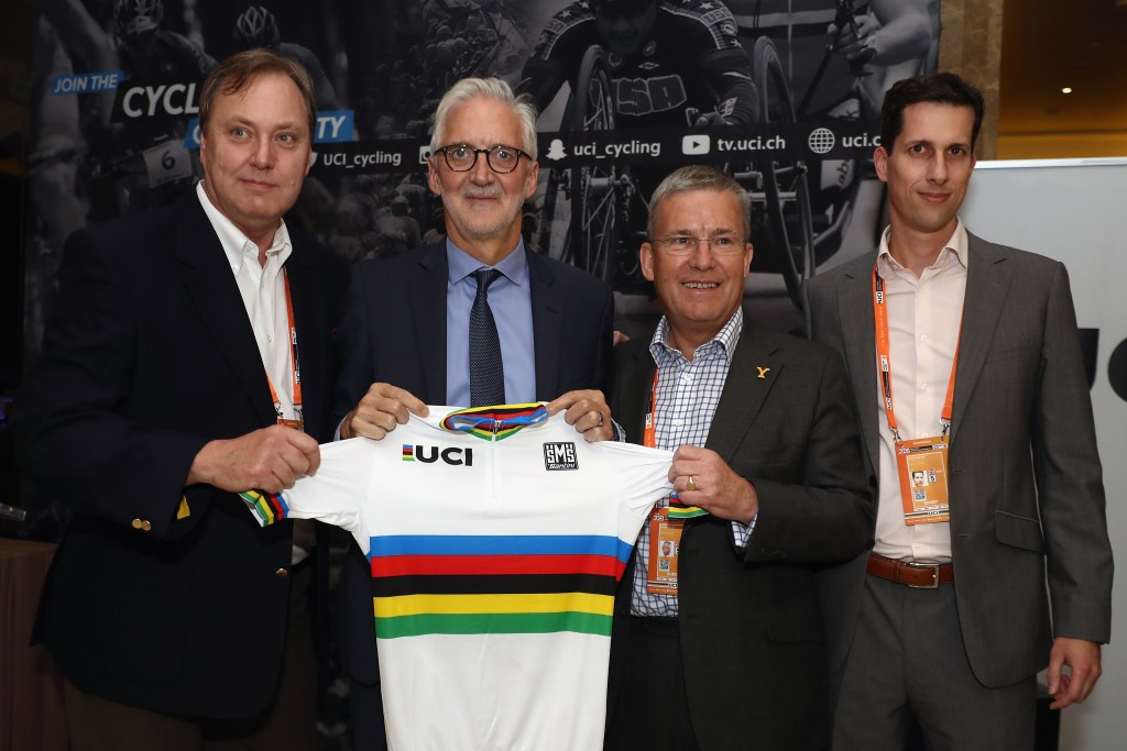 UCI President Brian Cookson (second left) poses with British Cycling President Bob Howden (left) after Yorkshire were announced as hosts of the 2019 UCI Road World Championships ©Getty Images 
