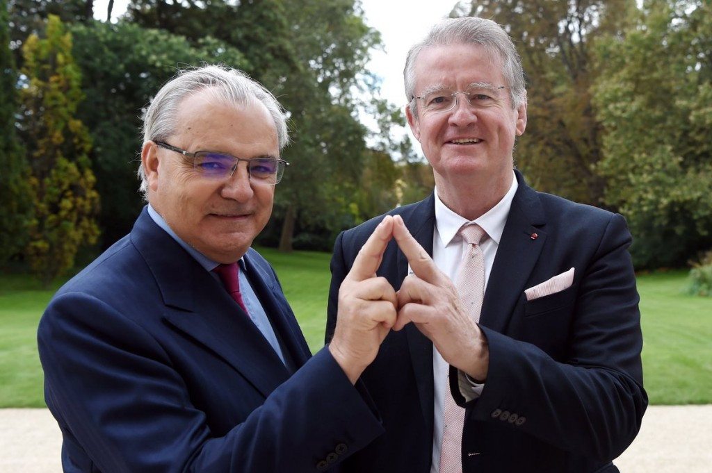 Paris 2024 co-chairman Bernard Lapasset, right, celebrates the new sponsorship deal with SUEZ chief executive Jean-Louis Chaussade, meaning the bid has now raised  €26 million in private sector funding ©SUEZ