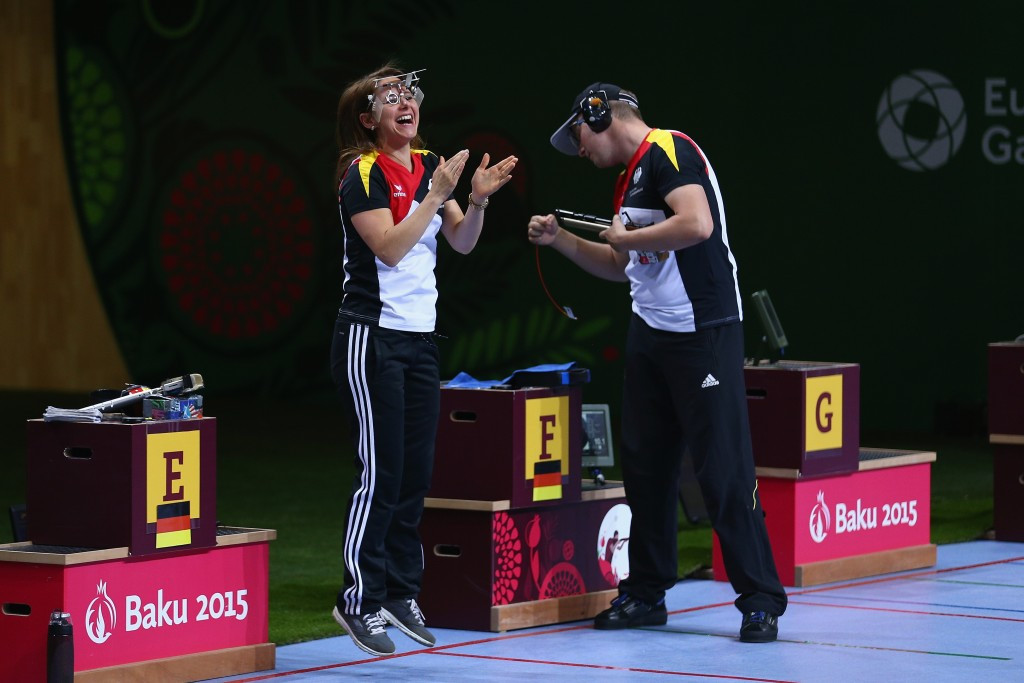 Germany's Monika Karsch celebrates with Christian Reitz after winning the final shooting gold medal of Baku 2015
