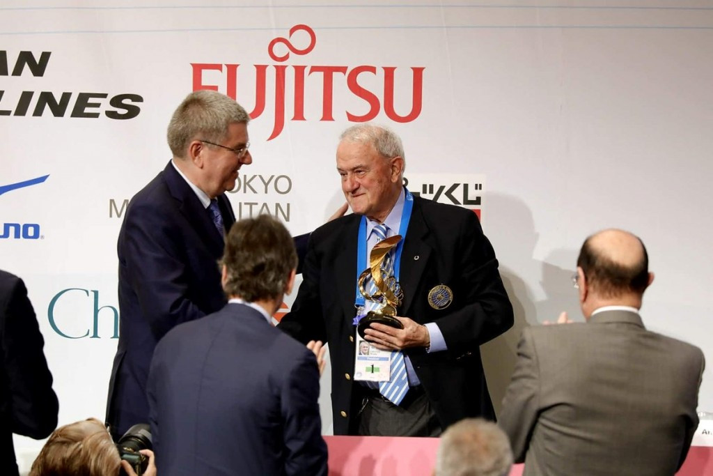 Bach awards IOC President's Trophy to departing FIG head Grandi at Congress