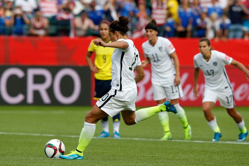 Carli Lloyd's second-half penalty and an earlier strike from Alex Morgan saw the United States reach the quarter-finals with a 2-0 win over Colombia