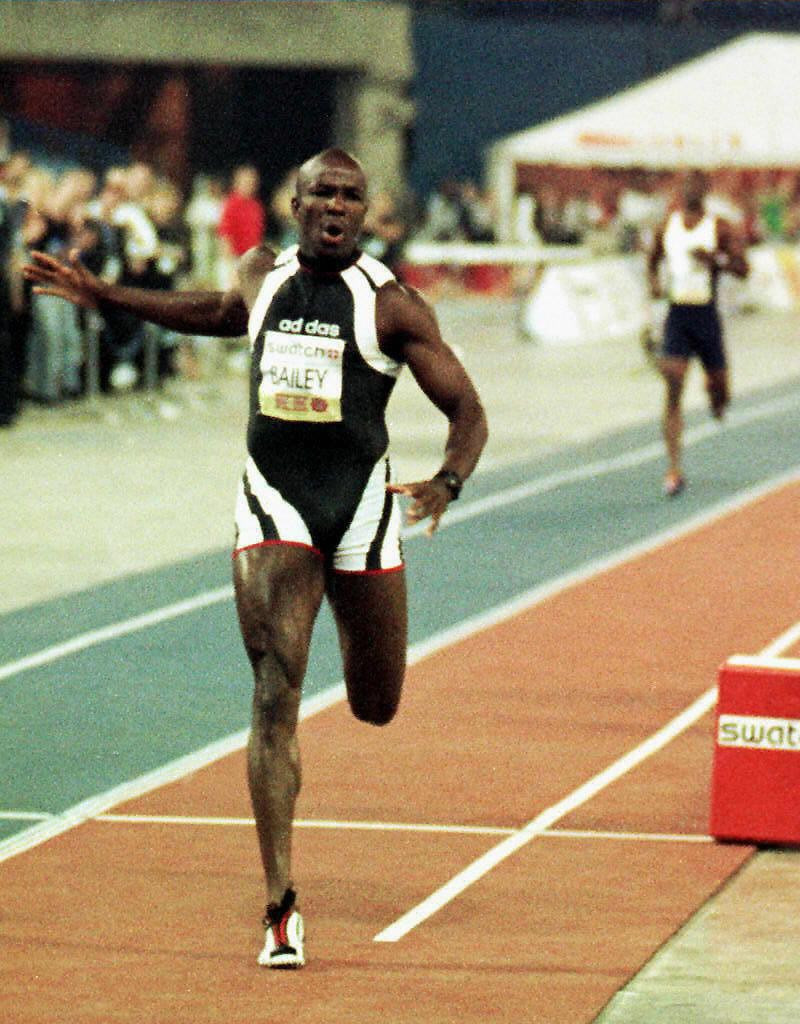 Donovan Bailey earns himself $1m for beating the distant figure of Michael Johnson in their 1997 