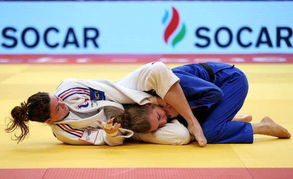 France's Helene Receveaux, in white, defeated Madrid European Open bronze medallist Theresa Stoll of Germany to win the women's under 57kg gold ©IJF