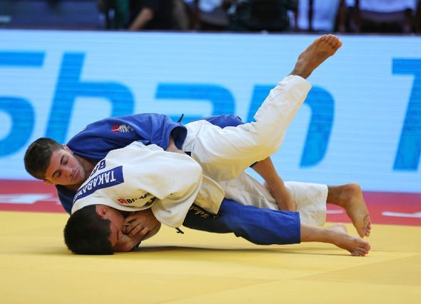 Spain's Francisco Garrigos, in blue, produced an inspired performance as the 21-year-old won all three of his contests to win his first Grand Slam gold medal in the under 60kg competition ©IJF
