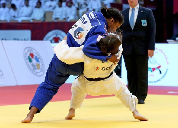 Marie Eve Gahie, in blue, won the under 70kg final in Abu Dhabi to become the youngest French judoka to win a medal at an IJF Grand Slam event ©IJF
