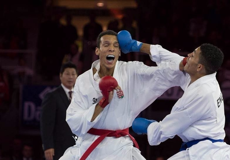Elsewhere, England’s Jordan Thomas (right) breezed to the men's under 67kg title after defeating Hungary's Martial Yves Tadissi (left) 8-0 ©WKF