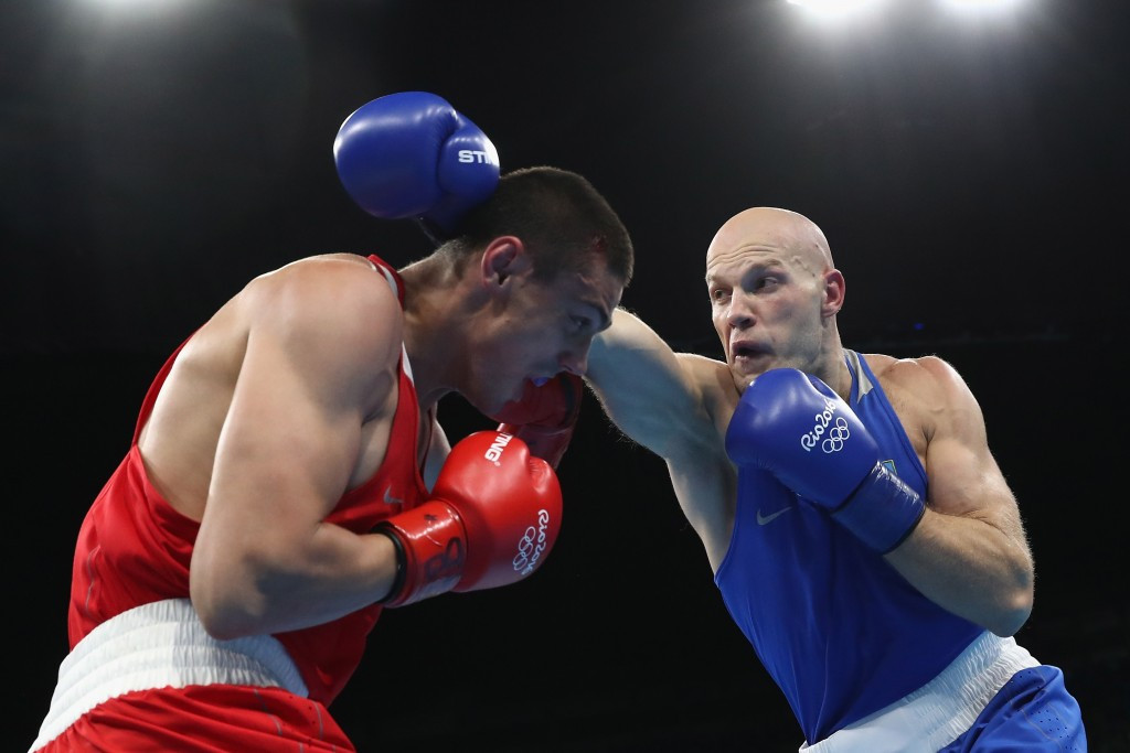 Evgeny Tishchenko, left, won the Olympic heavyweight final despite being on the back foot for most of the fight ©Getty Images