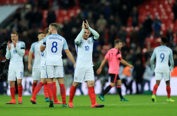England captain Wayne Rooney applauds the crowd at Wembley after their 3-0 win over Scotland in Friday's World Cup qualifying match - but his behaviour at the team hotel the following night failed to earn any applause ©Getty Images