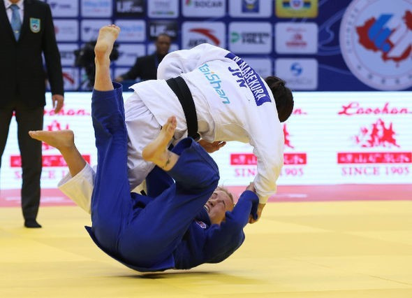 Japan's Nami Nabekura, white, claimed one of Japan's two gold medals today ©IJF