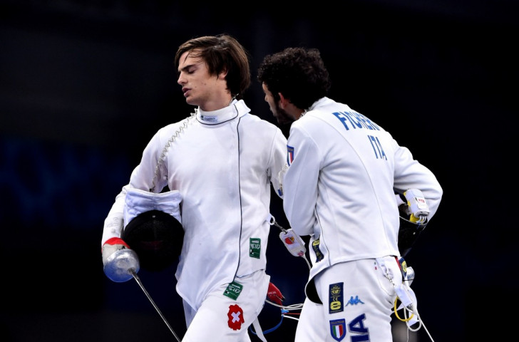 Italy's Marco Fichera (right) tries in vain to speak to clubmate Michele Niggeler after Switzerland's bronze medal 