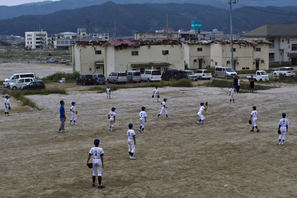Youngsters play baseball in disaster-hit Fukushima six months after the devastating earthquake hit in 2011 ©Getty Images