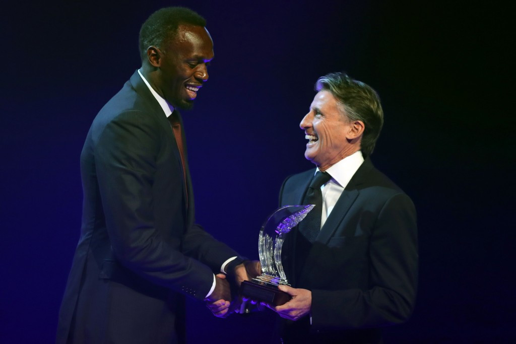 Usain Bolt, left, alongside Sebastian Coe when being named IAAF World Athlete of the Year ©Getty Images