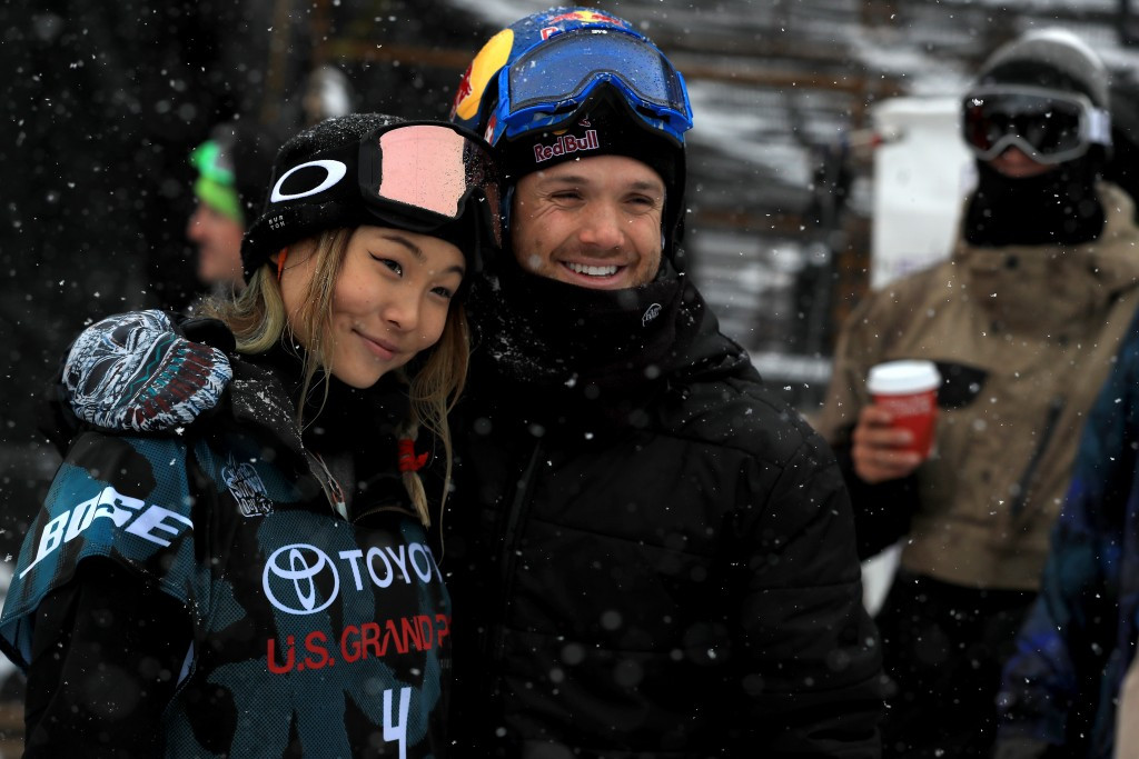 Chloe Kim is hugged by fellow American snowboarder Louie Vito after the competition ©Getty Images