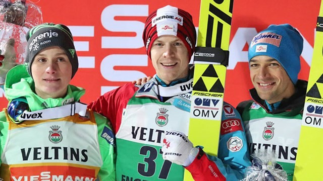 Austria's Michael Hayboeck (centre) returned to form in style as he secured his first victory of the season ©FIS