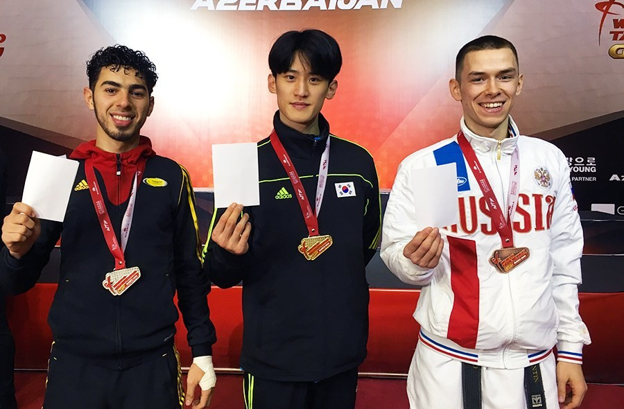 Medallists at the WTF Grand Prix Final held in Baku in Azerbaijan held up white cards to show support for the "Peace through Sport" initiative ©WTF