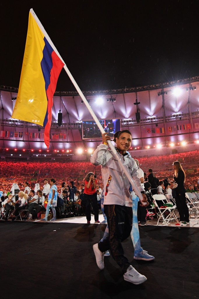 Carlos Serrano carries Colombia's flag at the Rio 2016 Closing Ceremony ©Getty Images