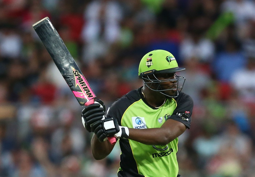 Andre Russell has been permitted to use the green and pink bat ©Getty Images