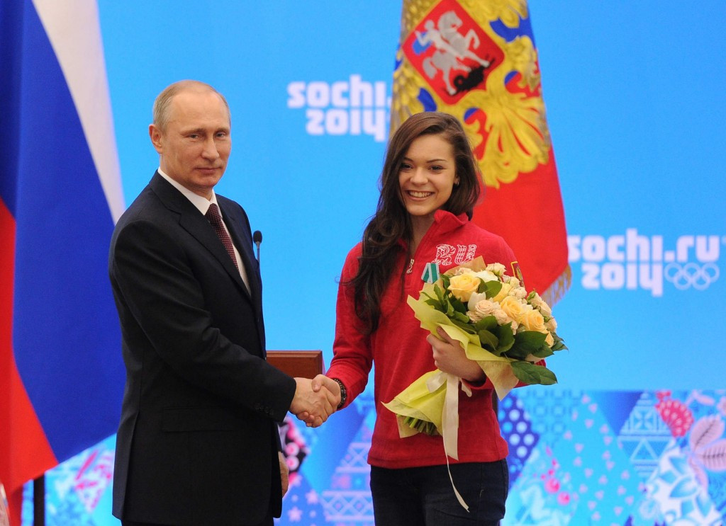 Adelina Sotnikova, right, with Russian President Vladimir Putin following her Olympic victory at Sochi 2014 ©Getty Images