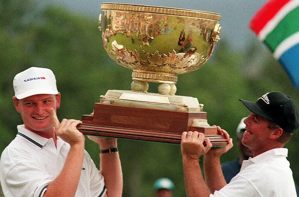 Ernie Els (left) lifting the World Cup of Golf trophy after winning it for South Africa alongside Westner in 1996 ©Getty Images