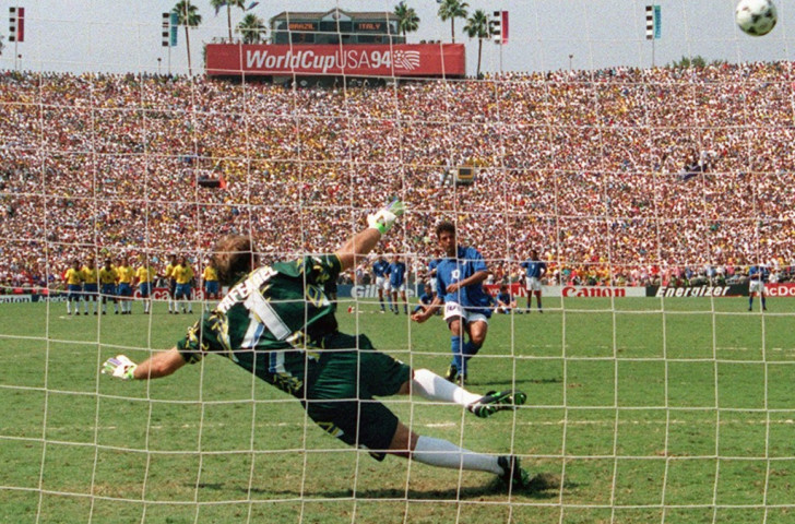 Italy's Roberto Baggio misses the crucial kick in the penalty shoot-out that ended with the 1994 World Cup going to the Brazilians lined up behind him. There'll be lots more of this drama in future FIFA productions we are sure ©Getty Images